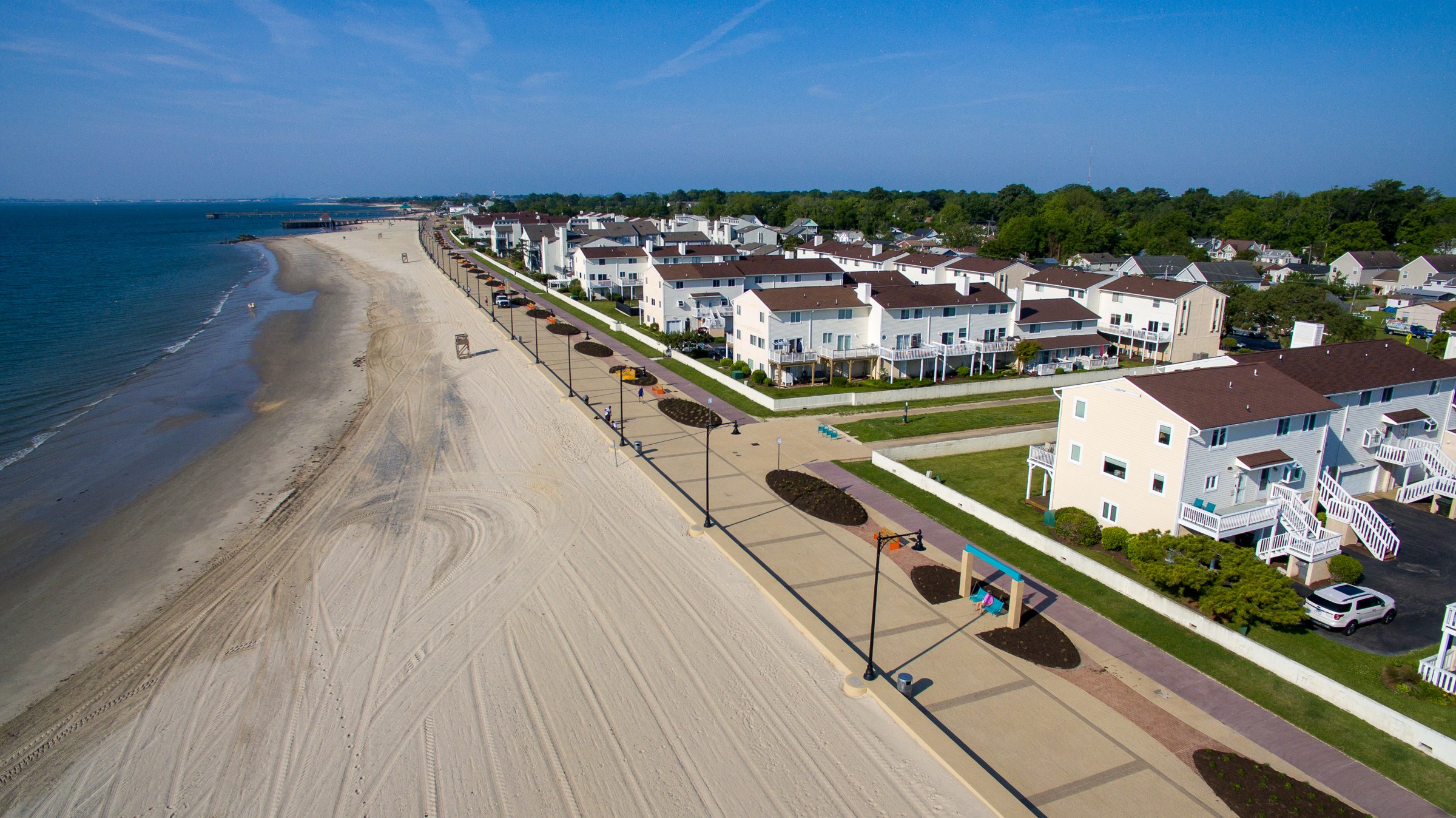 Aerial view of a waterfront promenade beside the beach